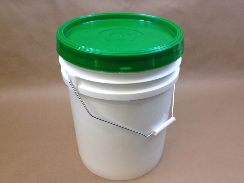 plastic bucket with green cover