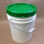 plastic bucket with green cover