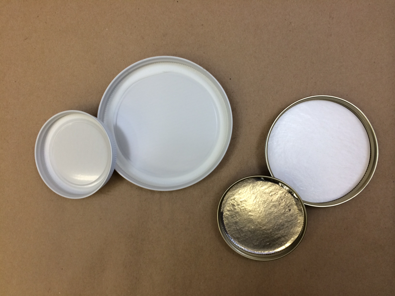 Plastisol Metal Caps. Foil and poly lined metal.