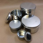 cookie tins, metal cans, holiday tins, ink can, slip cover cans.