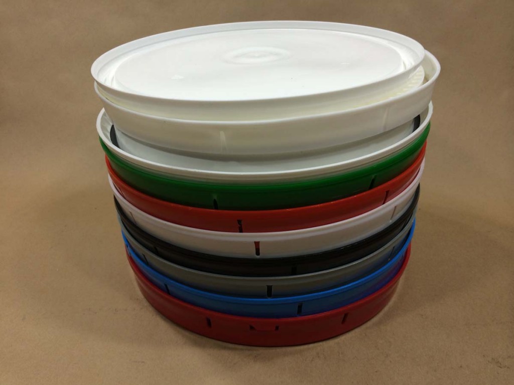 stack of covers for plastic buckets and pails Yankee Containers